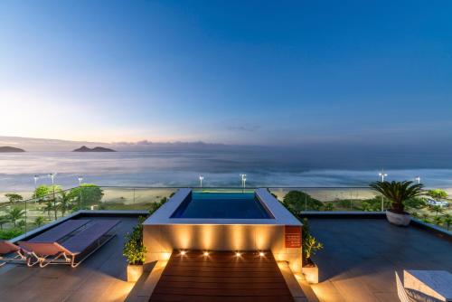 a view from the roof of a house with a swimming pool at Lifestyle Laghetto Collection in Rio de Janeiro