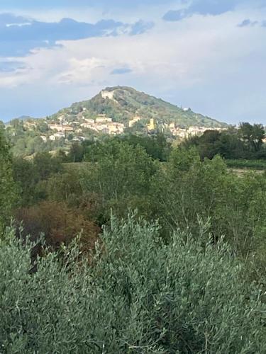 a mountain with a town on top of it at Residence19ilborgo in Asolo