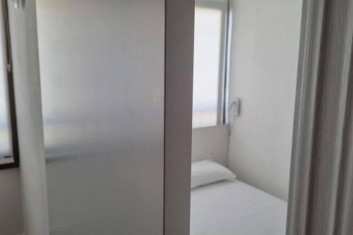 Postel nebo postele na pokoji v ubytování Coqueto Apartamento en la Playa