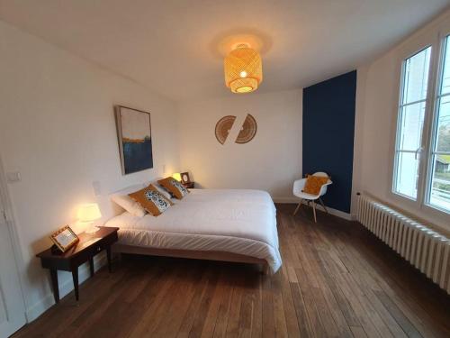 En eller flere senger på et rom på Maison de ville Montargis