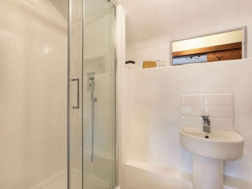 a bathroom with a shower and a toilet and a sink at 1 Bed in Yelverton 53533 in Yelverton
