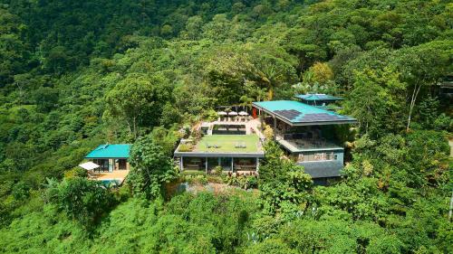 an aerial view of a house on a hill at Rancho Pacifico - Boutique Hotel for Adults in Uvita