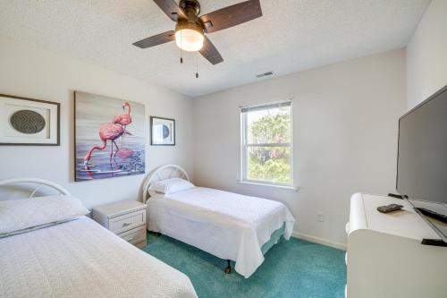 a bedroom with two beds and a ceiling fan at Charming Nags Head Retreat Half-Mi to State Park! in Nags Head
