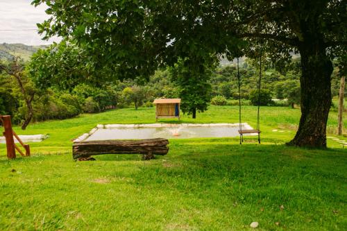 a skate park with a skate ramp and a tree at Pousada Mirante dos Ipês - Capitólio - MG in Capitólio