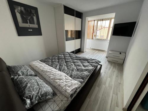 Ένα ή περισσότερα κρεβάτια σε δωμάτιο στο Apartament Teo Ultracentral