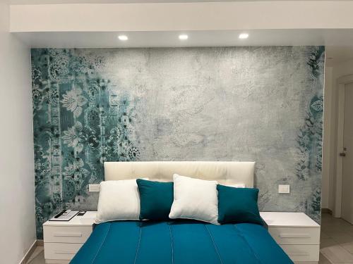 アルゲーロにあるR & Dのベッドルーム1室(青いベッド1台付)