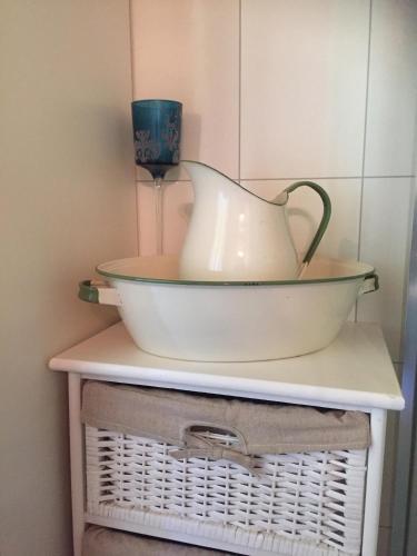 a bowl on a shelf with a vase on it at Kvaale Gard in Lom