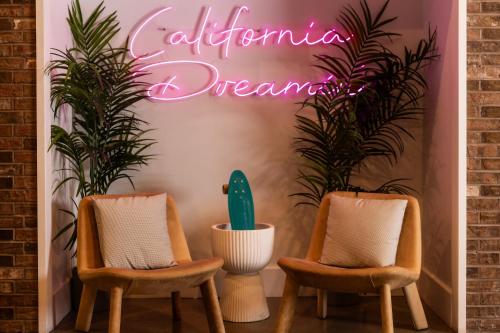 two chairs and a sign that reads autoimmune dream at Hotel Burbank in Burbank