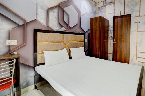 Krevet ili kreveti u jedinici u okviru objekta OYO Hotel Angle