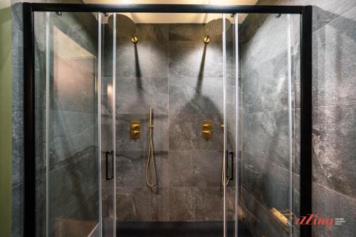 a shower with a glass door in a bathroom at Avalon Boutique in Valletta