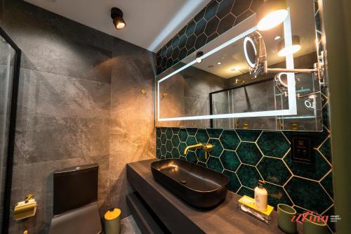 a bathroom with a sink and a mirror at Avalon Boutique in Valletta