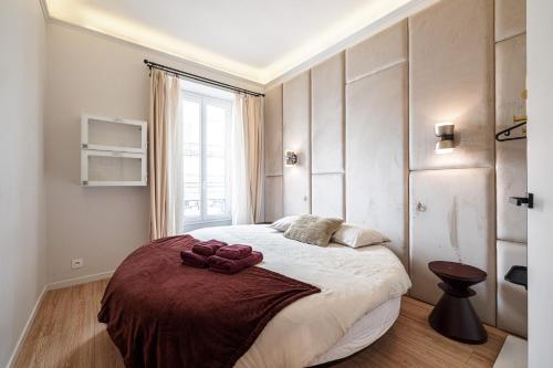 Tempat tidur dalam kamar di Au Coeur de La Libé
