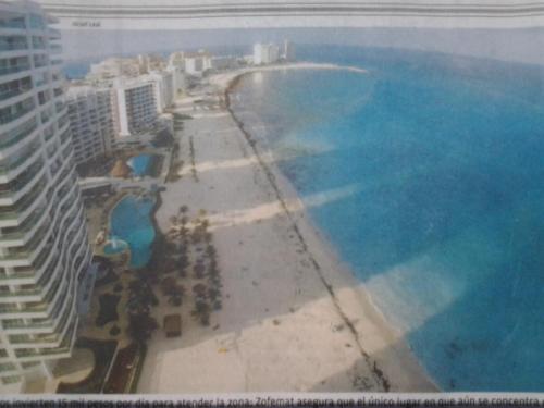 an aerial view of a beach and the ocean at Ocean View Condo in Cancún