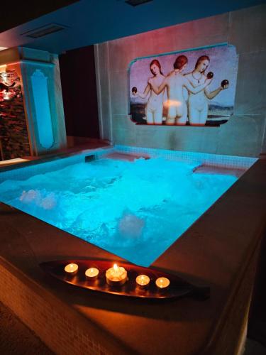 a bath tub with three women in a bath room at Park Hotel Plovdiv in Plovdiv