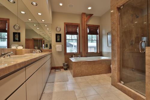 a large bathroom with a tub and a shower at Mountain Village Marvel with Hot Tub and Home Gym! in Telluride