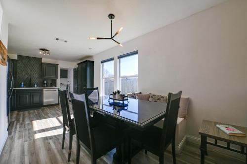 a kitchen and dining room with a table and chairs at Little Elm Diamond - Steps to Lewisville Lake! in Little Elm