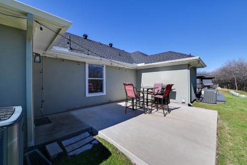 a patio with chairs and a table on a house at Little Elm Diamond - Steps to Lewisville Lake! in Little Elm