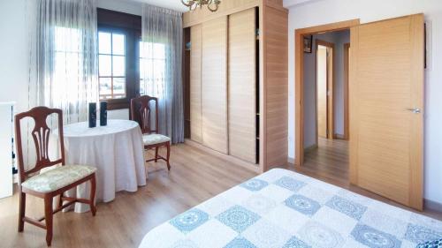Postel nebo postele na pokoji v ubytování AG Casa de Aldea Laxe con jardín y playa a 7km