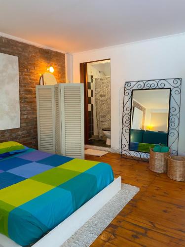 a bedroom with a bed and a large mirror at CASA DE RELAX CON PISCINA in Paraná