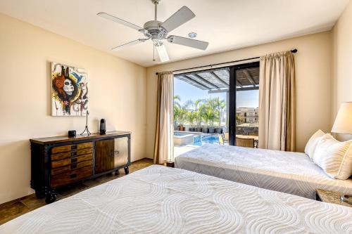 a bedroom with two beds and a window at Hermitage Paradise in Cabo San Lucas