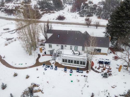 an aerial view of a house in the snow at Antlers on the Creek Bed & Breakfast in Durango