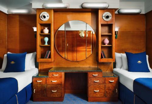 a room with a mirror and a dressing table at The Queen Mary in Long Beach