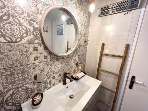 a bathroom with a sink and a mirror at Amethyst, luxury house nearby Delphi in Kírra