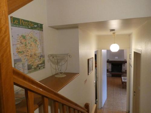 a hallway with a staircase leading to a room at Spacieux gîte au cœur du Perche - 3 chambres, jardin, cheminée, proche activités et Nogent-le-Rotrou - FR-1-581-67 in Trizay-Coutretot-Saint-Serge