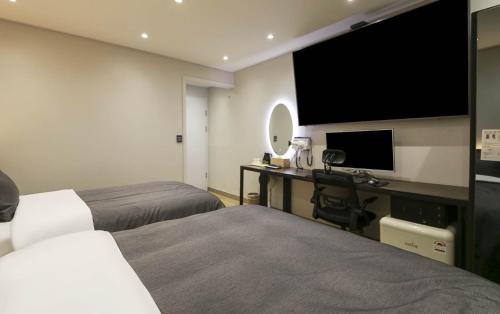 Кровать или кровати в номере Hey Gunsan Hotel