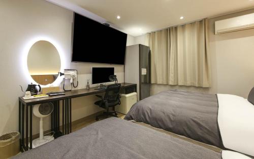 Кровать или кровати в номере Hey Gunsan Hotel