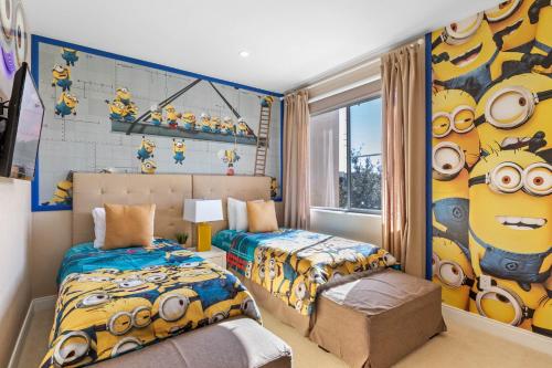 a bedroom with two beds and a mural of minions at 4 Bedroom- 4,5 Bathroom Magic Village 7603 Rd in Orlando