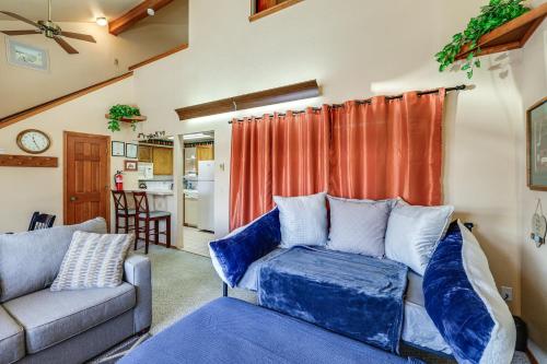 a living room with a couch and a table at Warm McCall Condo Half-Mile to Payette Lake! in McCall
