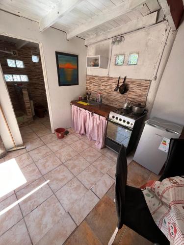 an overhead view of a kitchen with a counter and a stove at El remanso in Mar del Plata