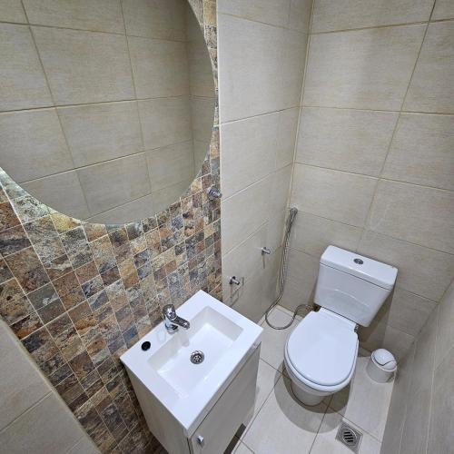 Ένα μπάνιο στο Brescia Apart Hotel