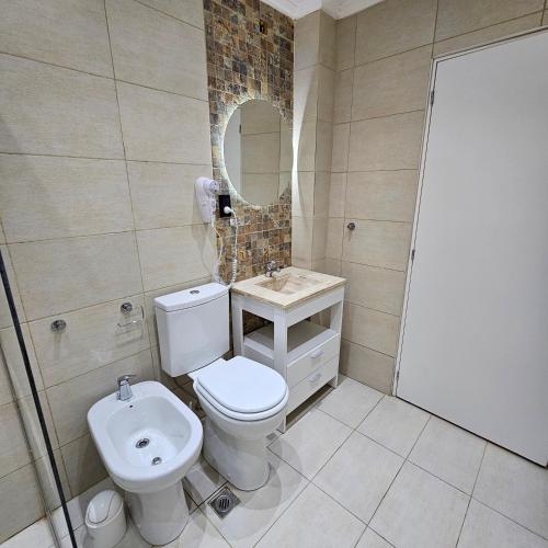Ένα μπάνιο στο Brescia Apart Hotel