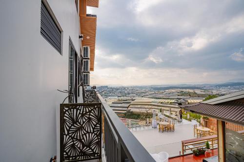 a balcony with a view of a city at Xuân Home in Trai Mat