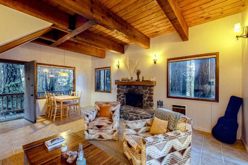a living room with a couch and a fireplace at Deep Woods Hideaway in Annapolis