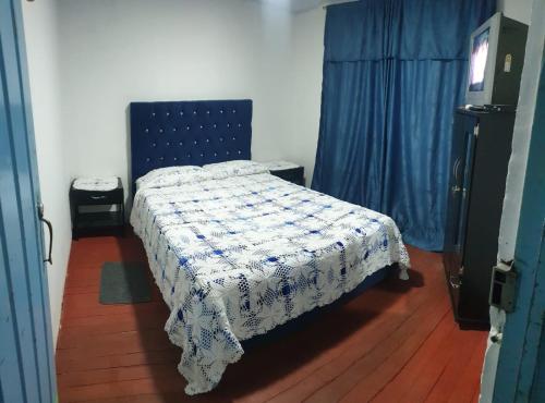 Postel nebo postele na pokoji v ubytování Hostal Perla Del Norte