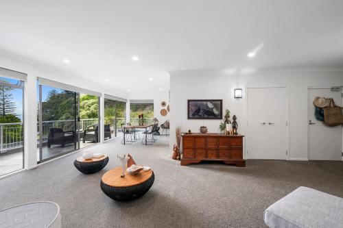 a living room with two large tires on the floor at Hillcrest Hideaway - Napier Holiday Apartment in Napier