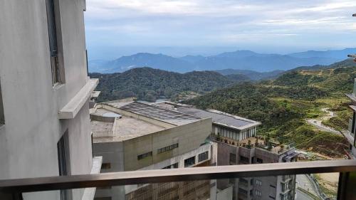 a view of the mountains from a building at QUINCE HOME GRAND ION DELEMEN GENTING HIGHLANDs in Genting Highlands