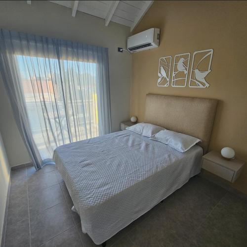 Ένα ή περισσότερα κρεβάτια σε δωμάτιο στο Brescia Apart Hotel