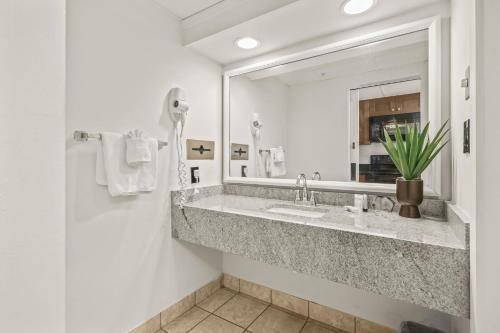 a bathroom with a sink and a mirror at 441 Landmark Resort in Myrtle Beach