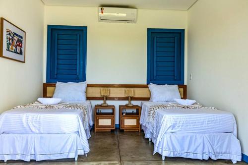 Een bed of bedden in een kamer bij Casa de Praia Perfeita