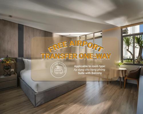 a hotel room with a free airport transfer one way sign on a bed at Tashi Ocean Hotel & Apartment Da Nang in Da Nang