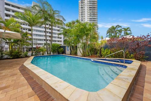 a swimming pool in the middle of a building at Hi Ho Beach Apartments on Broadbeach in Gold Coast