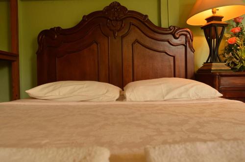 Cama o camas de una habitación en Hotel Real Leon