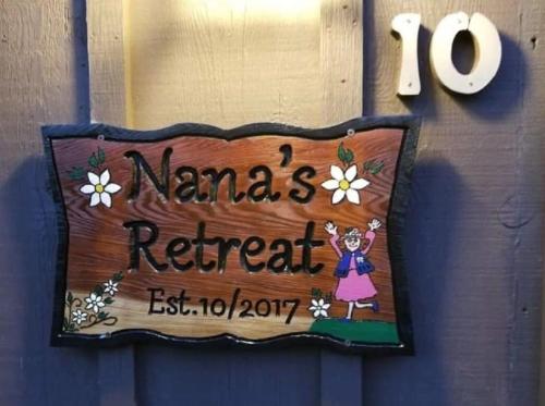 a sign for a nannas retreat on a door at Lovely 2 Bedroom Condo with Views of the Mountains in Gatlinburg