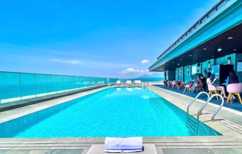 a swimming pool on the side of a building at Altara Apartment Quy Nhơn - 2Bed Room - Seaview in Quy Nhon