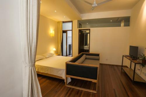 a bedroom with a bed and a window and a television at Shanghai Lane 里弄公寓 in Shanghai
