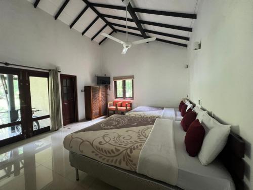 a bedroom with a large bed in a room at Grace Holiday Bungalow in Haputale